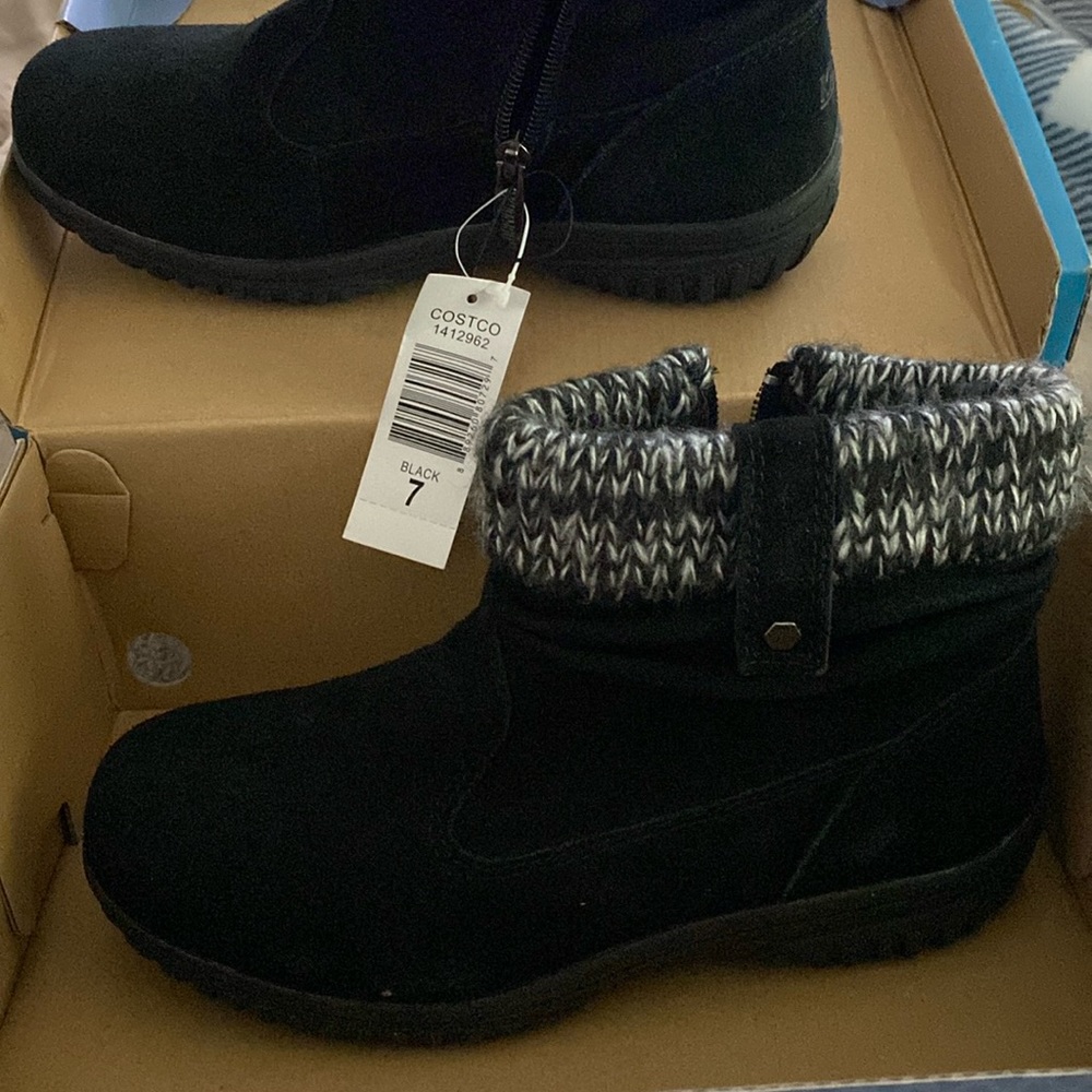 New and unused black boots with black n white fuzz on top